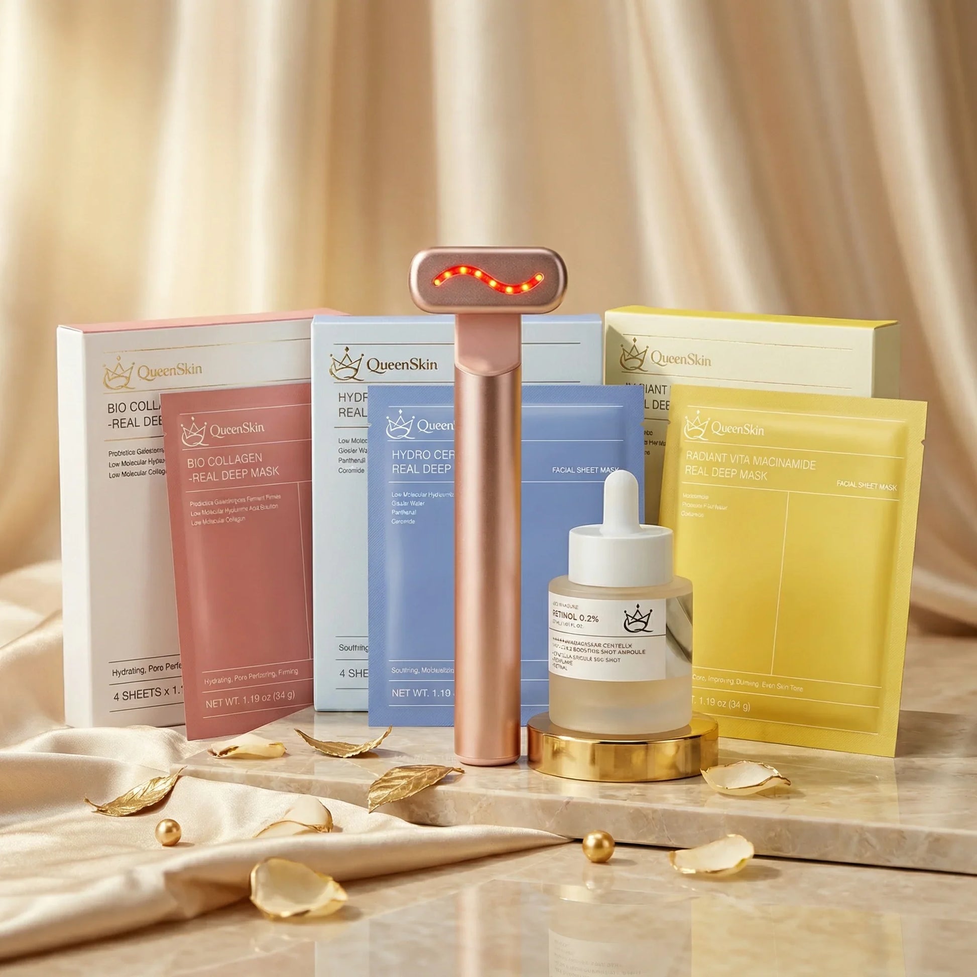 QueenSkin hydrogel masks, retinol serum, and microcurrent device on silk backdrop